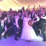 bride and groom with guests and fife wedding band the dirty martinis cow shed crail DIY wedding barn