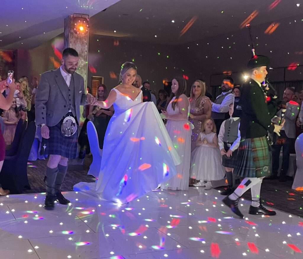 Bride and groom Jodie and Chris Algeo with fife wedding band the dirty martinis Richmond park hotel Fife wedding band the dirty martinis